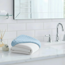 Blue Marshmallow Hooded Baby Towel folded on the bathroom vanity next to the sink | Baby Hooded Towel | Bath Time Essentials - Clair de Lune UK