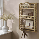 CuddleCo Aria Wave Bookshelf - Rattan by a window in a natural Scandi style nursery | Nursery Furniture | Bookshelves and Storage - Clair de Lune UK