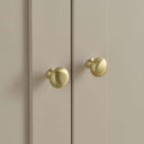 Close up of the satin handles on the Clara Wardrobe and Changing Unit, part of the Cashmere CuddleCo Clara 3 Piece Nursery Furniture Set in a cosy neutral nursery | Nursery Furniture | Cot Bed - Clair de Lune UK