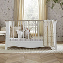 The Clara Cot Bed , part of the White CuddleCo Clara 3 Piece Nursery Furniture Set in a cosy neutral nursery | Nursery Furniture | Cot Bed - Clair de Lune UK