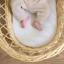 Baby lying on the Hypoallergenic Wicker Moses Basket Mattress | Moses Basket Mattresses | Moses Baby Basket Accessories | Nursery Bedding - Clair de Lune UK