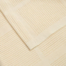 The cell construction and GOTs certified cotton fabric of the Cream Organic Cotton Cellular Blanket | Cosy Baby Blankets & Swaddles | Nursery Bedding | Newborn Baby Essentials - Clair de Lune UK