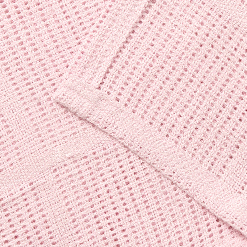 Showcasing the cell construction of the Soft Cotton Cellular Pram Blanket in pink to keep babies warm in the winter and cool in summer | Cosy Baby Blankets | Nursery Bedding | Newborn, Baby and Toddler Essentials - Clair de Lune UK