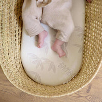 Baby lying on Natural Bamboo Palm Moses Basket Mattress (74 x 28 cm) in a palm moses basket | Moses Basket Mattresses | Newborn Bedding - Clair de Lune UK