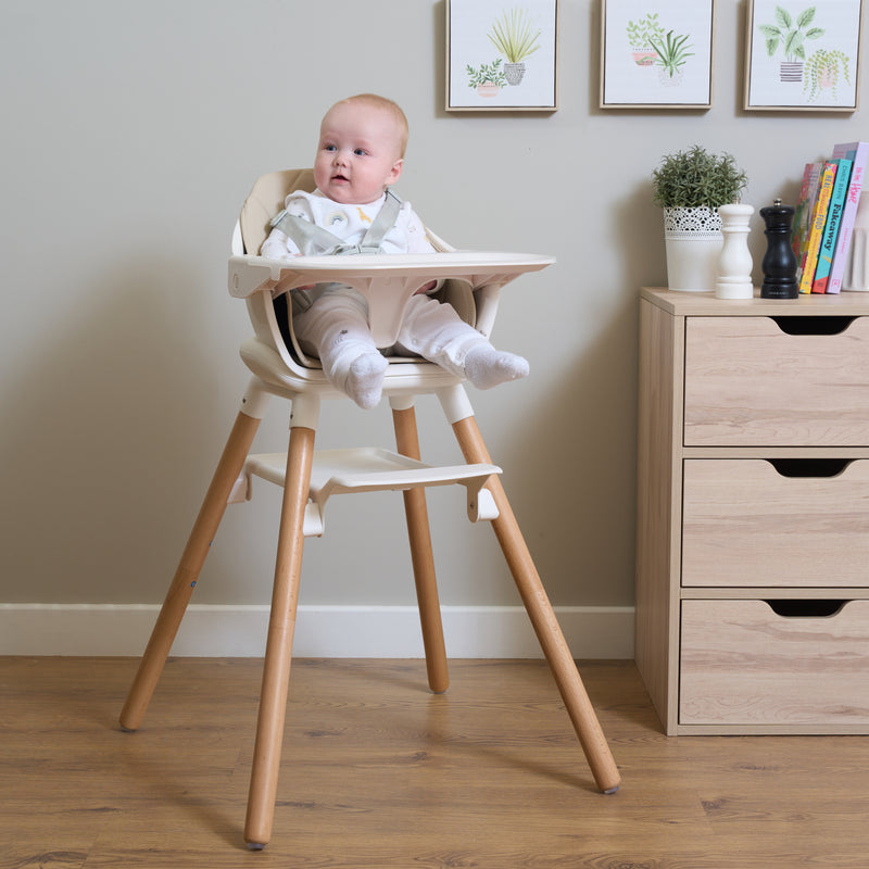 Baby sat in the beige 6in1 High Chair waiting for his dinner in the kitchen | Highchairs | Feeding & Weaning - Clair de Lune UK