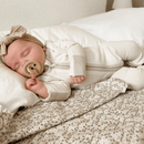 Baby wearing the Cashmere Grow Grows Organic Pinstripe Sleepsuit | Baby Grows and Onesies | Organic Baby Clothes - Clair de Lune UK