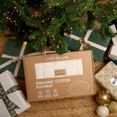 Organic Baby Play Mat in beautiful brown box packaging sitting under the Christmas tree surrounded by beautifully wrapped gifts | Baby Play Mats & Gyms | Baby Tummy Time Toys - Clair de Lune UK