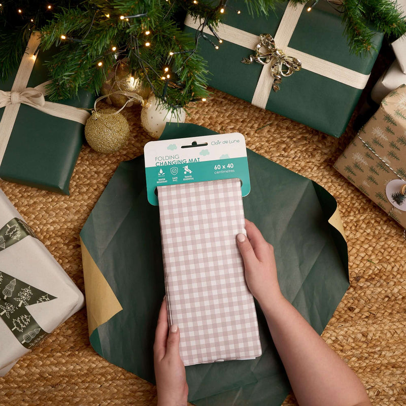 Gingham Foldable Travel Changing Mat being unwrapped under the Christmas Tree | Baby's First Christmas | Christmas Gifts for Baby and newborn 2025 - Clair de Lune UK