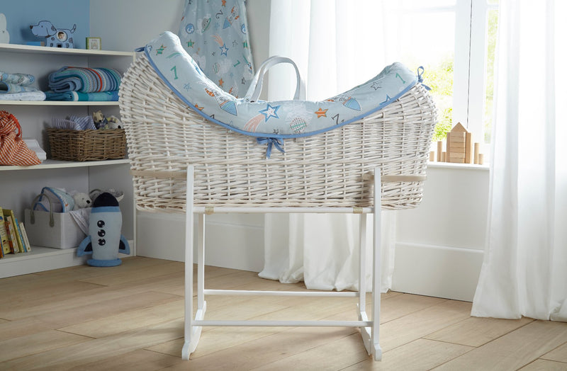 Profile view of the Forty Winks White Wrapover Noah Pod on white deluxe stand in blue space themed nursery | Bassinets & Moses Baskets - Clair de Lune UK