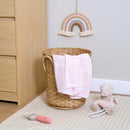 Pink Soft Cotton Cellular Shawl draped in a wicker basket next to a changing unit in the nursery surrounded by soft toys | Cosy Baby Blankets & Swaddles | Nursery Bedding | Newborn Baby Essentials - Clair de Lune UK