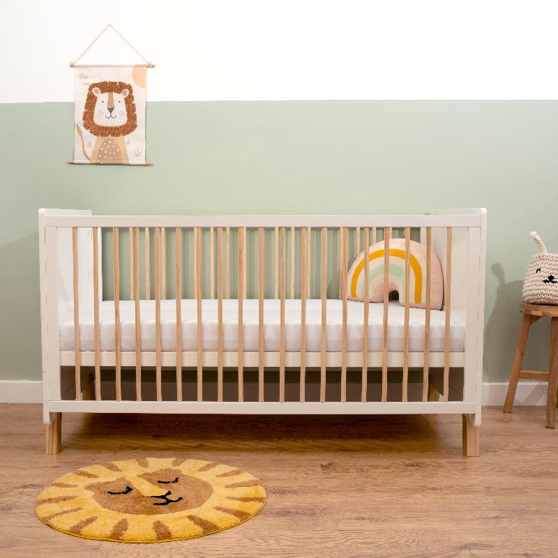 Essenitals Cot Bed with Hypoallergenic Fibre Mattress in a sage green nursery with wooden floor | Cot, Cot Beds and Toddler Beds | Nursery Furniture - Clair de Lune UK