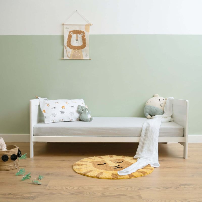 White Essentials Cot Bed as a kid bed in a sage green Scandi nursery room | Cots, Cot Beds, Toddler & Kid Beds | Nursery Furniture - Clair de Lune UK