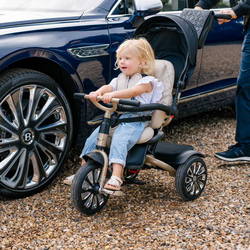 Little girl sitting on the Mulliner Bentley 6in1 Trike - Convertible Baby Stroller | Strollers, Pushchairs & Prams | Pushchairs, Carrycots & Car Seats Baby | Travel Essentials - Clair de Lune UK