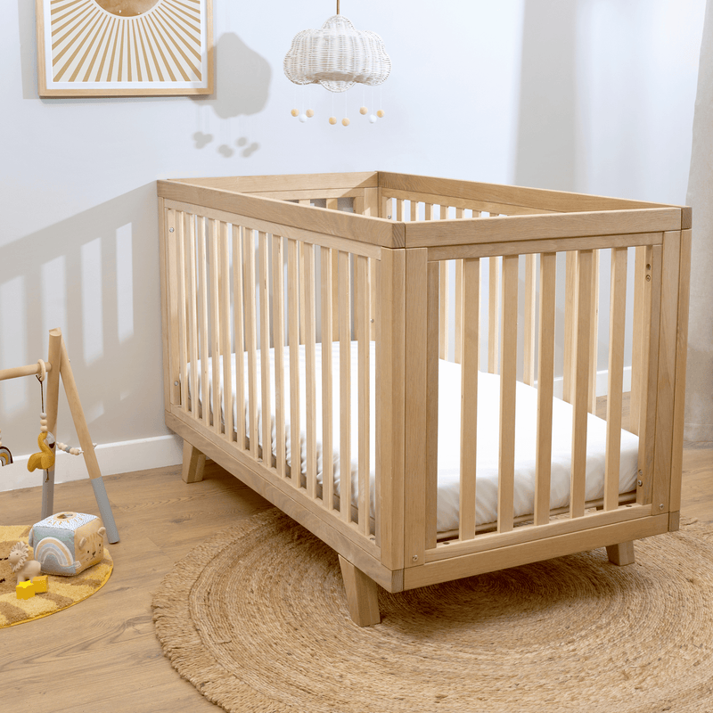 Oak Cot Bed with mattress in a Scandi Natural Nursery Room | Cots, Cot Beds, Toddler & Kid Beds | Nursery Furniture - Clair de Lune UK