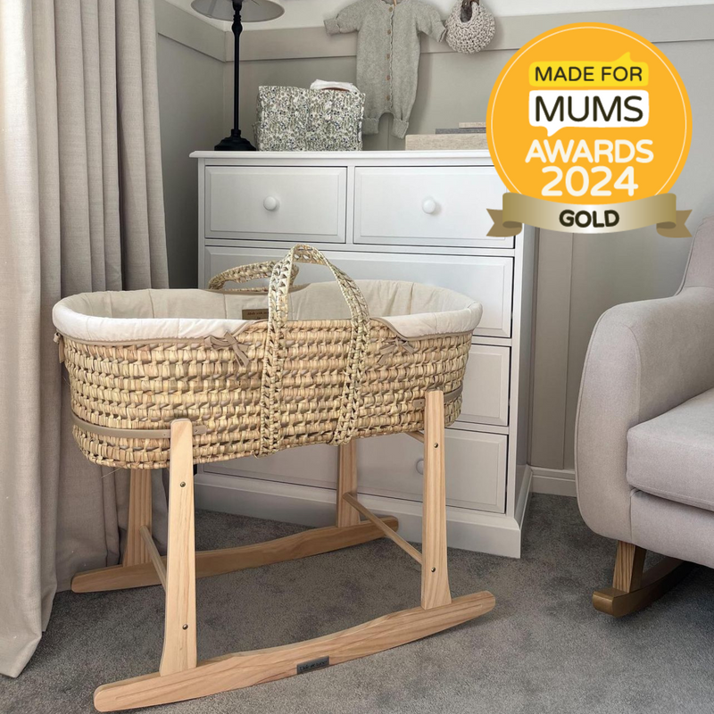 Scandi Cream Organic Palm Moses Basket on the Natural Deluxe Rocking Stand with a blanket as a decor | Moses Baskets and Stands | Co-sleepers | Nursery Furniture - Clair de Lune UK