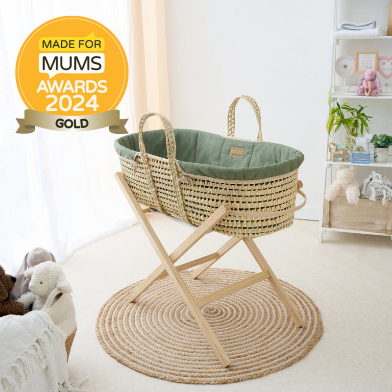 Organic Palm Moses Basket in Forest Green on a Natural Folding Stand with the Made for Mums award-winning badge | Moses Baskets and Stands | Co-sleepers | Nursery Furniture - Clair de Lune UK
