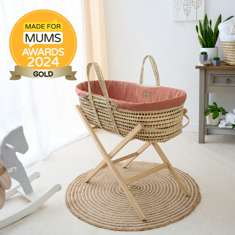 Organic Palm Moses Basket in Rust Orange on a Natural Folding Stand with the Made for Mums award-winning badge | Moses Baskets and Stands | Co-sleepers | Nursery Furniture - Clair de Lune UK