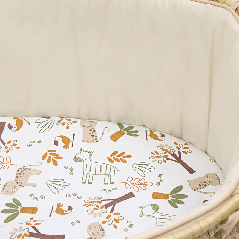 Sandshell Savannah Palm Moses Basket with the creamy fabrics and savannah print sheet zoomed in | Moses Baskets | Co-sleepers | Nursery Furniture - Clair de Lune UK