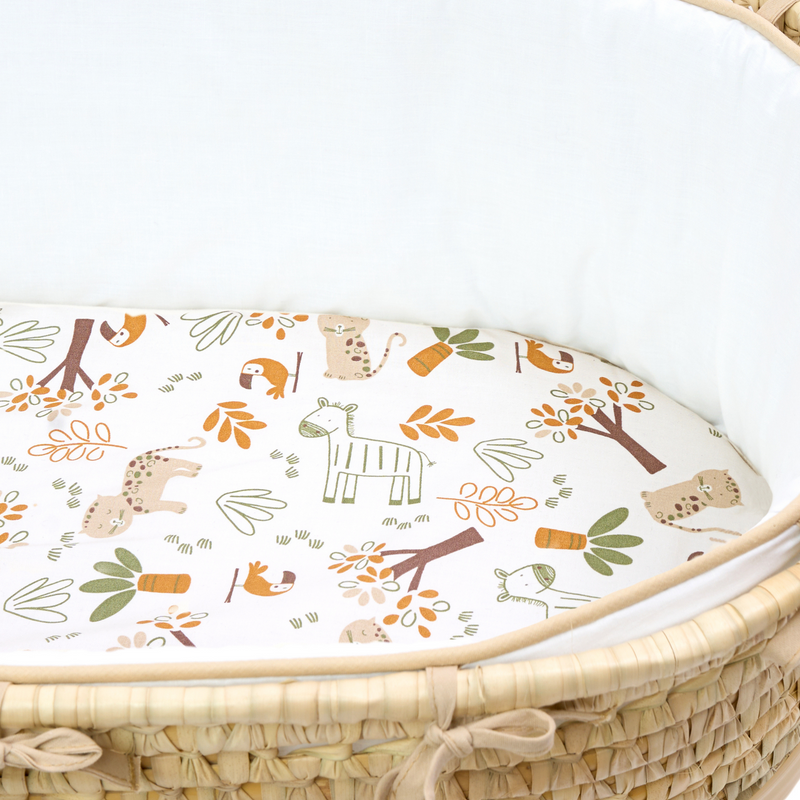 White Savannah Palm Moses Baskets with the white dressing and savannah print sheet zoomed in | Moses Baskets | Co-sleepers | Nursery Furniture - Clair de Lune UK