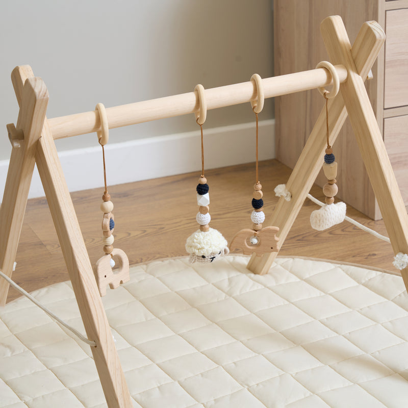 Natural Wooden Play Gym Set up on the Cream Organic Play Mat | Baby Play Mats & Gyms | Baby Tummy Time Toys - Clair de Lune UK