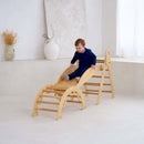 Child playing on the montessori 3 in 1 wooden activity climbing set in a minimalistic room | Toys | Indoor Play Equipment  | Climbing Frames - Clair de Lune UK