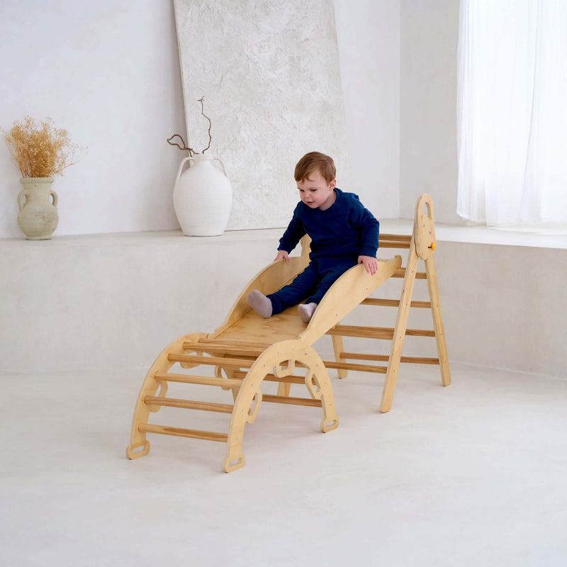 Child playing on the montessori 3 in 1 wooden activity climbing set in a minimalistic room | Toys | Indoor Play Equipment  | Climbing Frames - Clair de Lune UK
