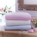 A stack of Cotton Candy Blankets in three different colours | Cosy Baby Blankets & Swaddles | Nursery Bedding | Baby Christmas Gift - Clair de Lune UK
