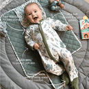 Baby smiling wearing the Grow Grows Organic Country Leaf Sleepsuit with key features | Baby Grows and Onesies | Organic Baby Clothes - Clair de Lune UK