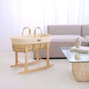 Natural Cream Organic Knitted Palm Moses Basket on natural rocking stand in a white ultra stylish minimalist living room next to an organic cork and glass coffee table | Moses Baby Baskets, Bassinets | Organic Baby Essentials | Nursery Furniture - Clair de Lune UK