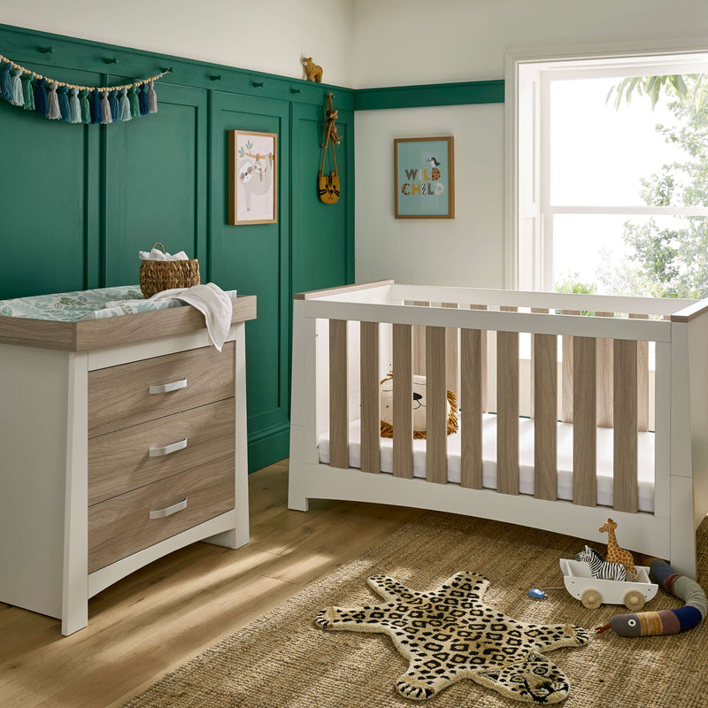 White and Natural 2-piece room set including a natural and white cot bed and a matching changer from the CuddleCo Ada Cot Bed & Nursery Room Sets in a trendy green nursery room | Nursery Furniture Sets | Room Sets | Nursery Furniture - Clair de Lune UK