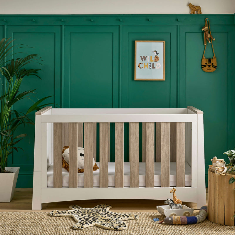 White and Natural Cot Bed from the CuddleCo Ada Cot Bed & Nursery Room Sets in a trendy green nursery room | Nursery Furniture Sets | Room Sets | Nursery Furniture - Clair de Lune UK