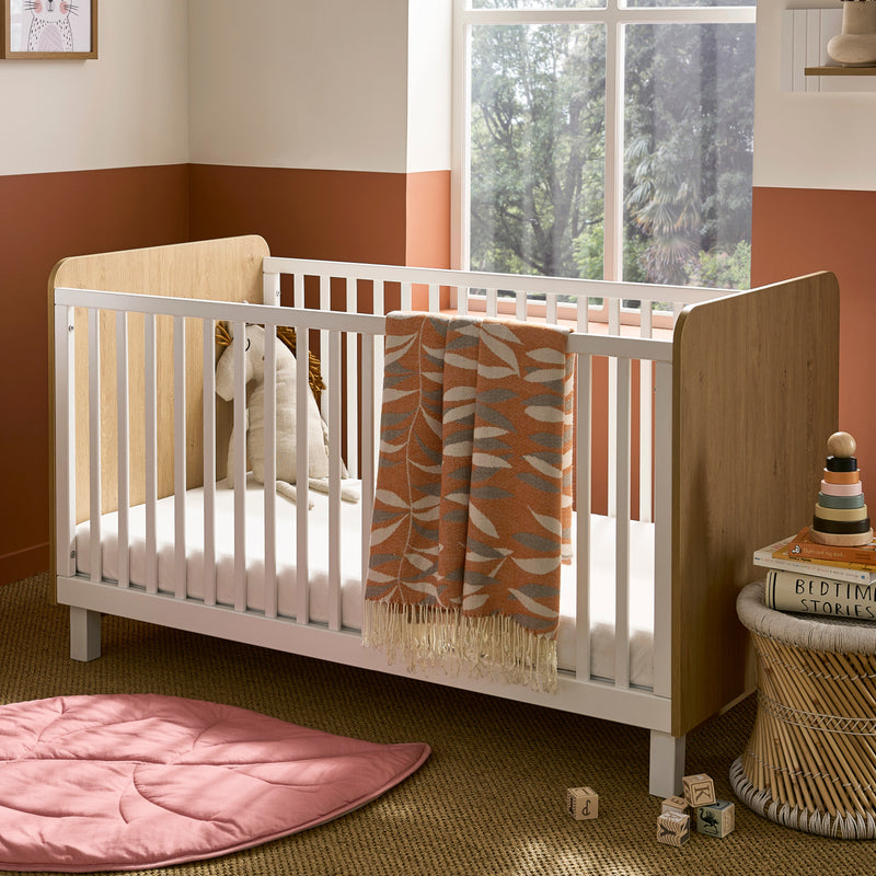 Natural Wood and White CuddleCo Rafi Cot Bed in a 60s-inspired nursery | Cots, Cot Beds, Toddler & Kid Beds | Nursery Furniture - Clair de Lune UK