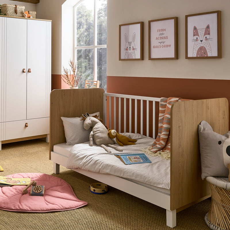 Natural Wood and White CuddleCo Rafi Cot Bed next to the Rafi Double Wardrobe | Cots, Cot Beds, Toddler & Kid Beds | Nursery Furniture - Clair de Lune UK