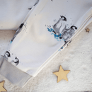 GrowGrows Organic Plodding Penguins Pyjamas close up one the family of penguins and ribbed cuff | Organic Kids PJs and Nightwear - Clair de Lune UK