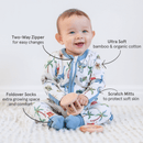 Baby smiling wearing the Grow Grows Organic Dandy Dinos Sleepsuit with key features  | Baby Grows and Onesies | Organic Baby Clothing - Clair de Lune UK