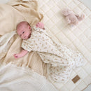 Newborn baby wearing the Little Dreamers Luxury Organic Swaddle Bag on the Organic Play Mat | Baby Swaddle Bag | Newborn Sleeping Bag | Nursery Bedding - Clair de Lune