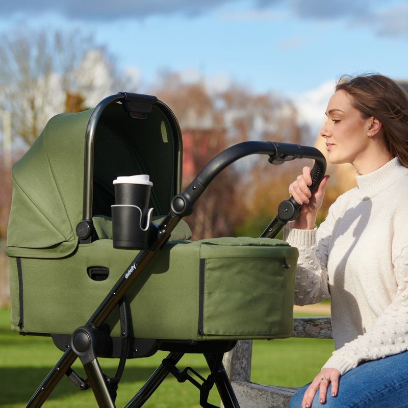 Mom next to her Didofy Stargazer Green Collapsible Carrycot | Moses Baskets | Co-sleepers | Travel Cribs | Baby & Kid Travel - Clair de Lune UK