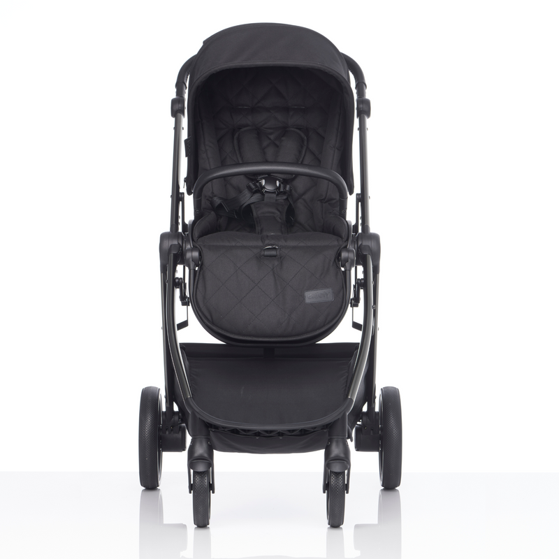  The comfortable footrest of the Black Stargazer Pushchair in the Didofy Black Stargazer 11 Piece Ultimate Travel System Bundle in a park | Didofy | Pushchairs and Travel Systems | Baby & Kid Travel - Clair de Lune UK