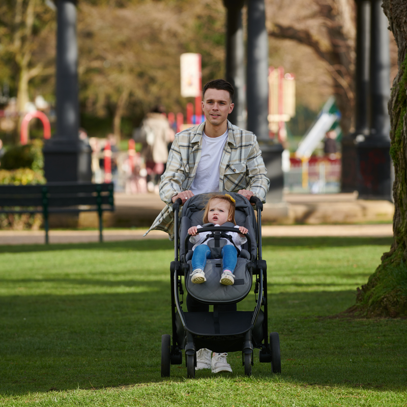 Dad wheeling toddler in the Didofy Grey Stargazer 11 Piece Ultimate Travel System Bundle in a park | Didofy | Pushchairs and Travel Systems | Baby & Kid Travel - Clair de Lune UK