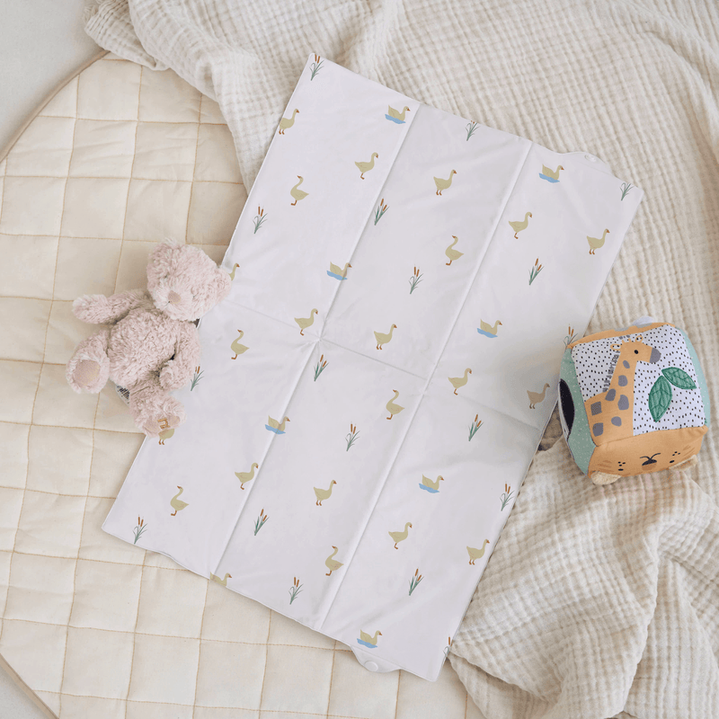 Duck patterned Foldable Travel Changing Mat laid flat on the cream organic play mat | Baby Change Mats | Bathing & Changing Essentials - Clair de Lune UK