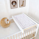 East Coast Safari Playtime Changing Mat on cot top changer in a white nursery with lion and giraffe picture on the wall | Bathing & Changing Essentials - Clair de Lune UK