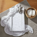 East Coast Safari Playtime Changing Mat on the floor with white muslin and nappies | Bathing & Changing Essentials - Clair de Lune UK
