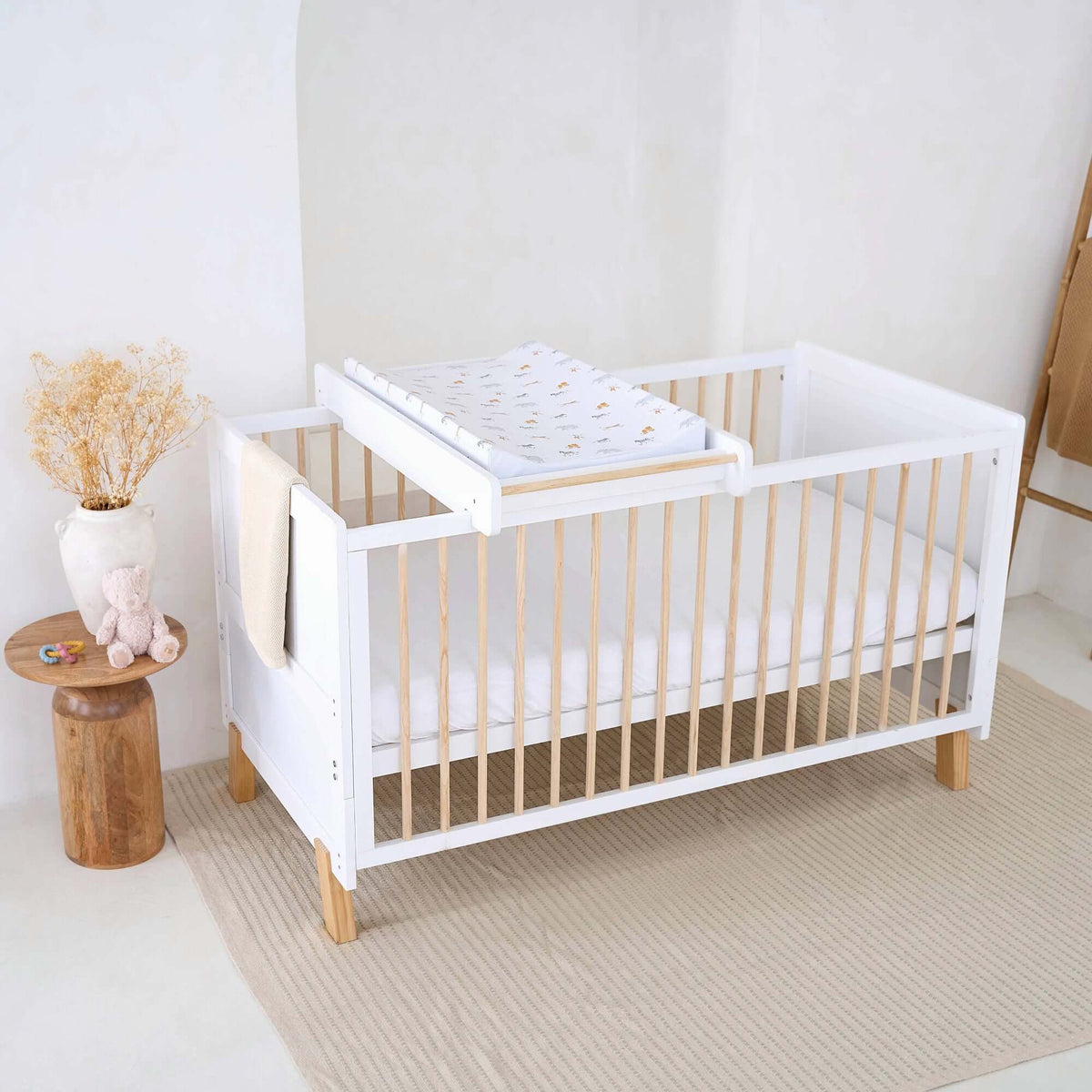 White Essentials Cot Top Changer in a bright white minimalist nursery room | Cots, Cot Beds & Toddler Beds | Nursery Furniture - Clair de Lune UK