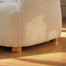 Bunny CuddleCo Etta Kids Chair Boucle in a cosy corner of the nursery with a close up on the fabric and wooden feet | Toddler Arm Chair | Children's Furniture - Clair de Lune UK