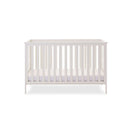 White Obaby Evie Cot Bed with an adjustment platform at the lowest level | Cots, Cot Beds, Toddler & Kid Beds | Nursery Furniture - Clair de Lune UK