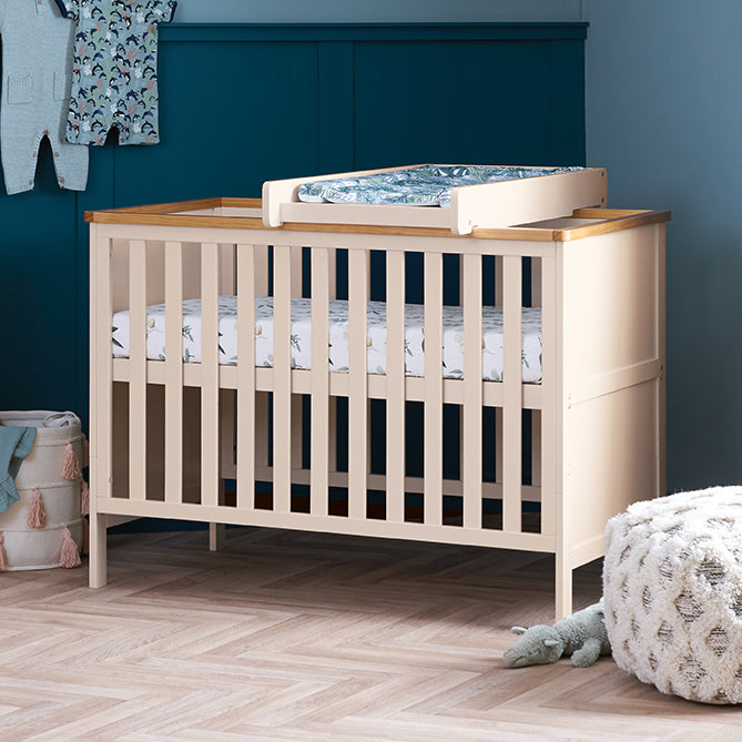 Cashmere Obaby Evie Mini Cot Bed in an Ocean-themed nursery room with the cot top changer | Nursery Furniture | Baby, Toddler and Kids Essentials - Clair de Lune UK