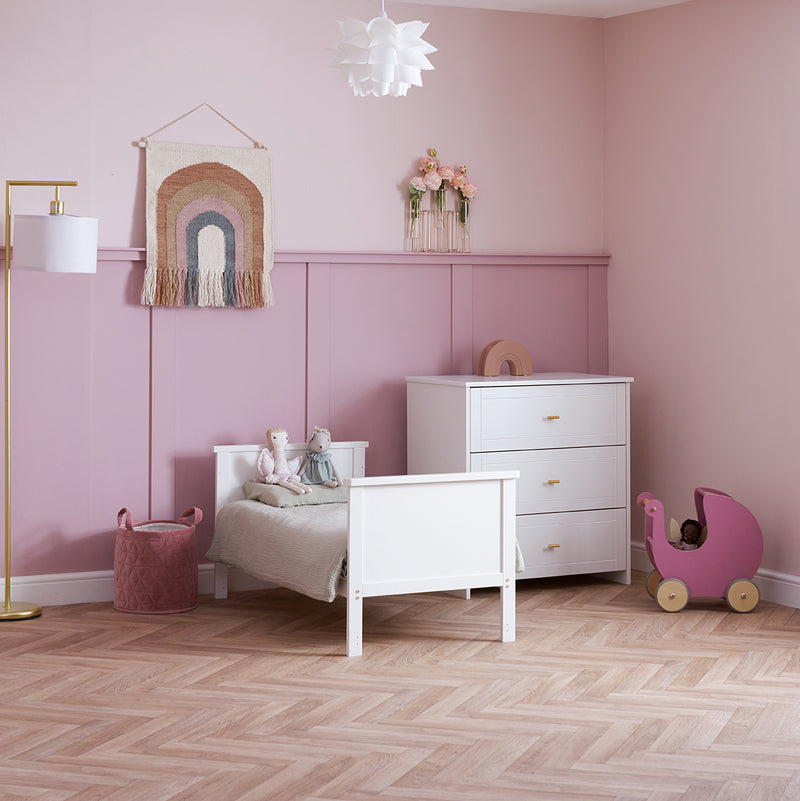The cot bed and changer of the White Obaby Evie Mini 2 Piece Room Set in a pastel pink Disney princess-theme nursery room | Nursery Furniture Sets | Room Sets | Nursery Furniture - Clair de Lune UK