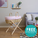 Pink Stripe Palm Moses Basket on Natural Folding Stand in living room with Free Mattress Protector while stocks last | Moses Baby Baskets, Bassinets | Nursery Furniture - Clair de Lune UK
