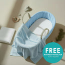 Blue Fleece Palm Moses Basket Bundle including cellular shawl and mattress on a stylish flat lay Plus Free Mattress Protector for a limited time | Moses Baby Baskets and Bassinets - Clair de Lune UK