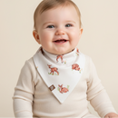baby smiling at the camera wearing the GrowGrows Fleeting Fawn Bib | Bamboo Babywear | Feeding Essentials - Clair de Lune UK